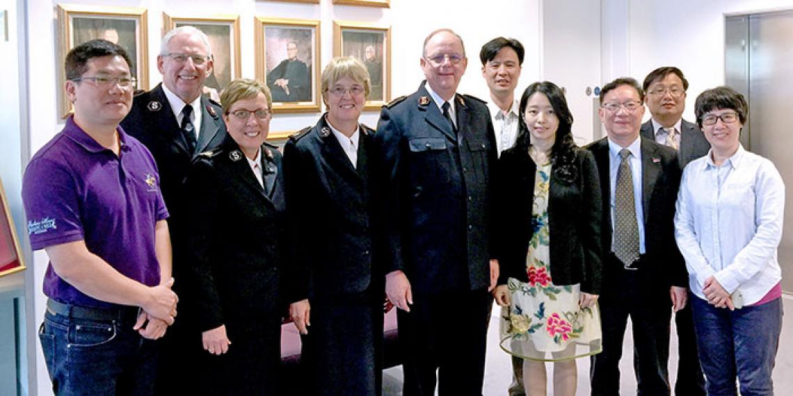 The photograph shows (from left) Mr Guang-ling Que (Section Chief of the Ethnic and Religious Affairs Bureau of Guangzhou), the Chief of the Staff, Commissioner Rosalie Peddle (World Secretary for Women's Ministries), Commissioner Silvia Cox (World President of Women's Ministries), the General, the Rev Sui-sheng Chen (Administrative Vice President of Guangzhou Christian Council), Miss Dan Chen, the Rev Hao Feng, the Rev Bing-sheng Lin (Vice President of Guangzhou Christian Council) and Mrs Xiao-xing Feng-D