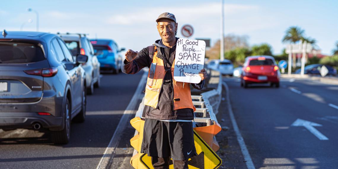Man begs for spare change in Auckland traffic