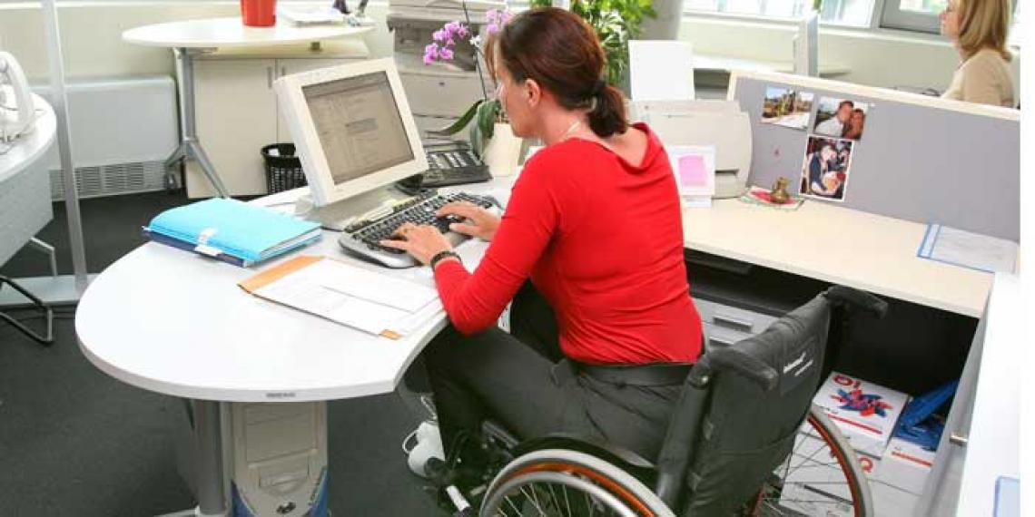 Woman in a wheelchair at work